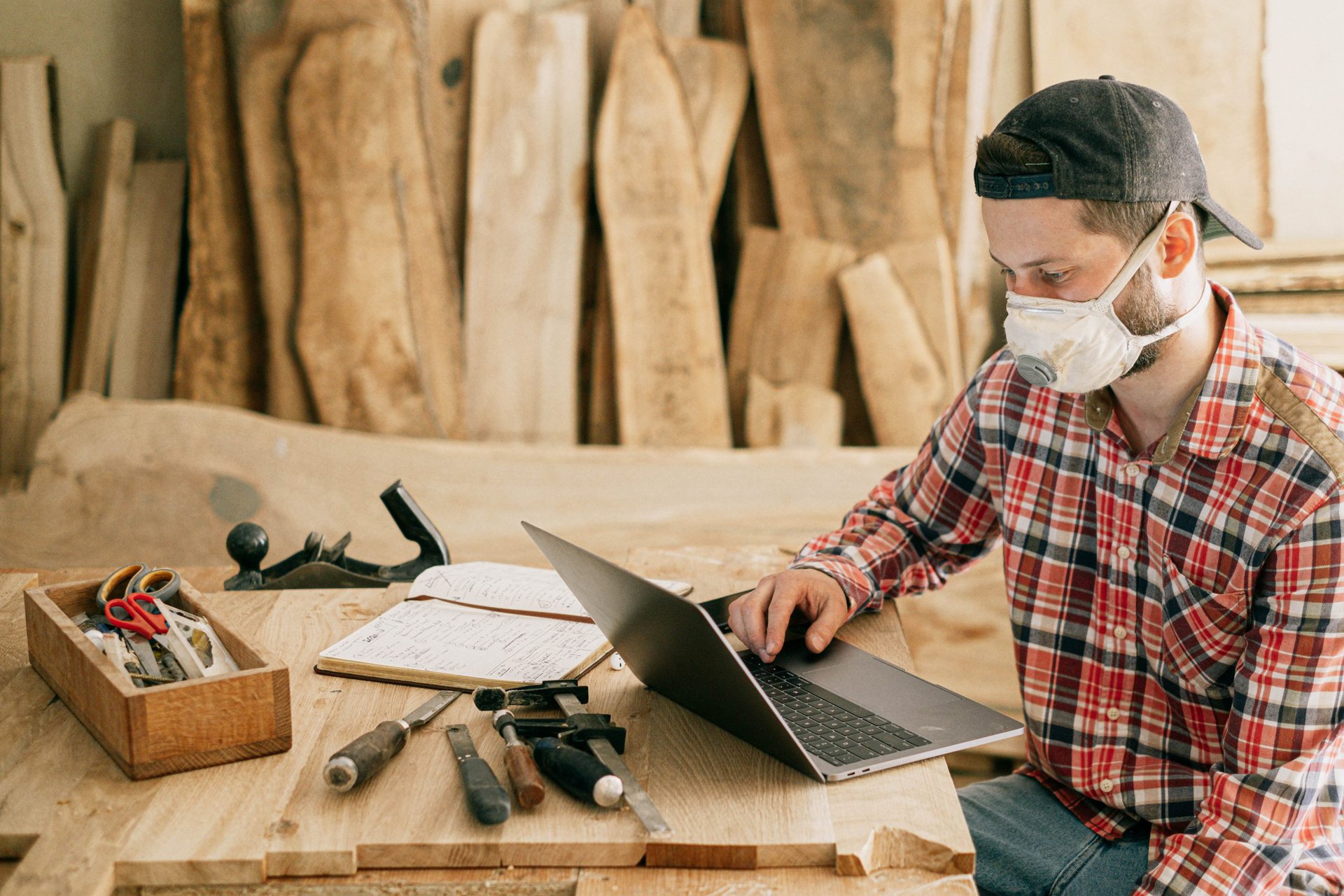 man sanding wood